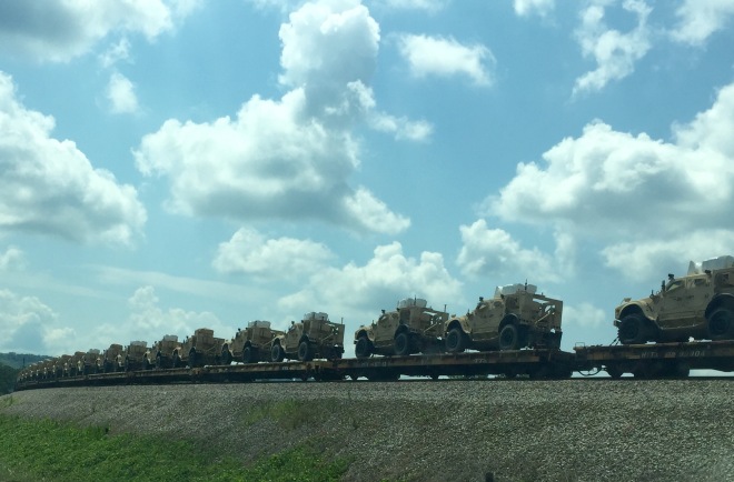 Military Vehicles on Train Image
